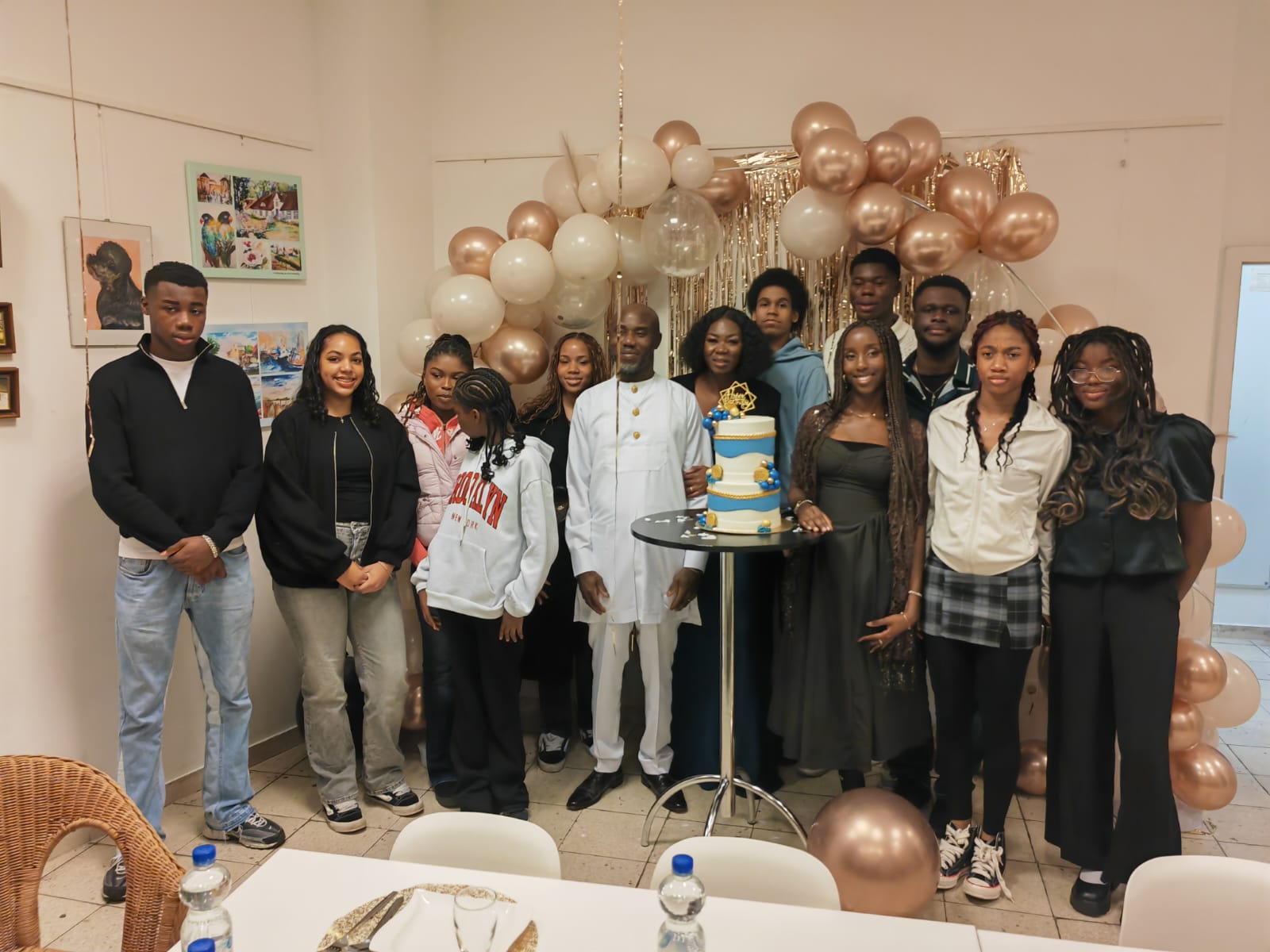 Celebration with cake and balloons at Inspire Youth Club