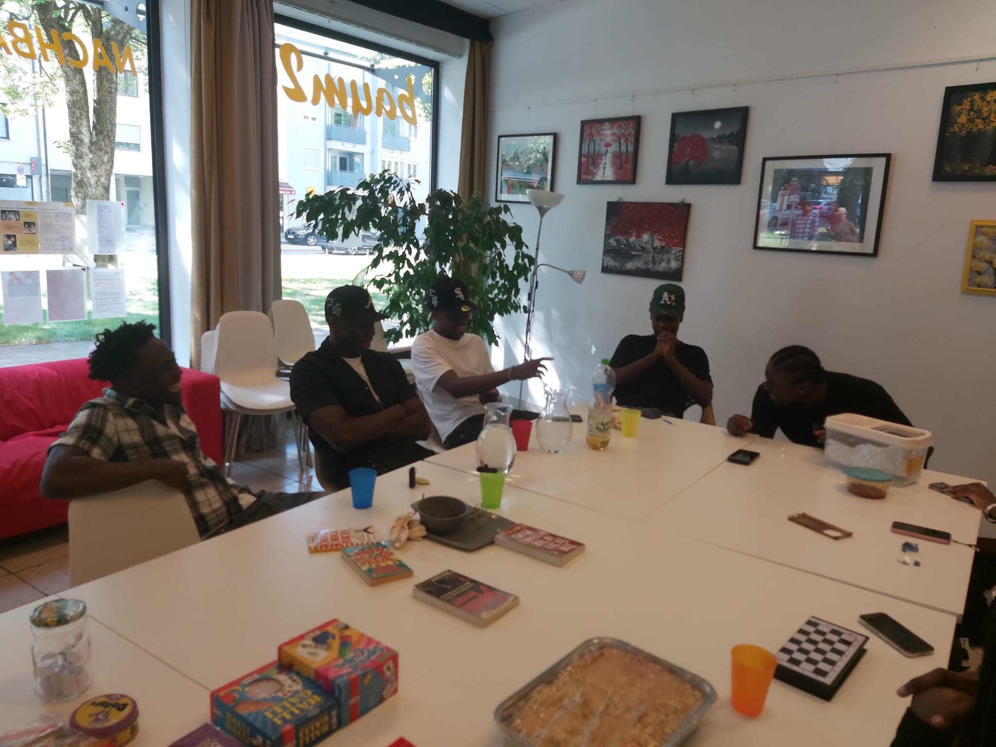 Teens playing board games and chess at Inspire Youth Club